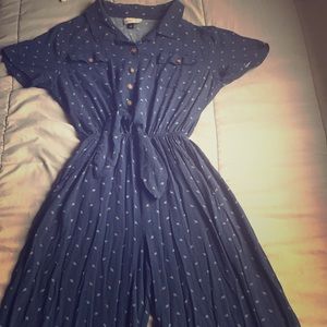 navy blue jump suit with vintage brown buttons.